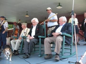 bakerdog_blog2 Carlock Stooksbury, John Rice Irwin and former U.S. Sen. Howard H. Baker Jr. (in chairs) watch a beagle cross the stage Saturday. "Heartland" creator Steve Dean is behind them.
