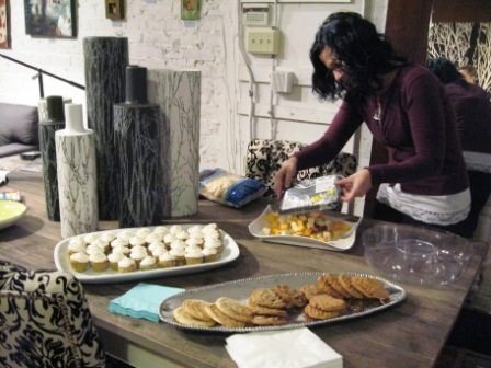 bliss-home Artist Erika Smith puts out nibbles at Bliss Home on Market Square where her art was on display