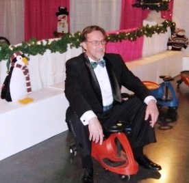 Dr. Reid Crumpton was trying to get off his feet while waiting for his wife to come out of the ladies' room. He found a spot in "Rudolph's Raceway!"