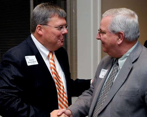 Birmingham, left, meets County  Commissioner Bud Armstrong