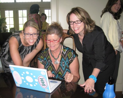 at-computer From left, Danielle Benson, Annette Beebe and Marigail Mullins gather around a laptop to try out the "spread the message" process.