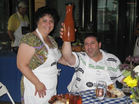 ghada-and-faris-eid Ghada and Faris Eid, two of the evening's hosts, propose a toast with barbecue sauce!