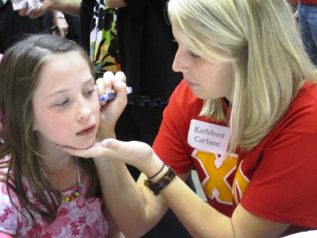 kathleen The Chi Omega sorority was painting faces. This artist is Kathleen Carlson.