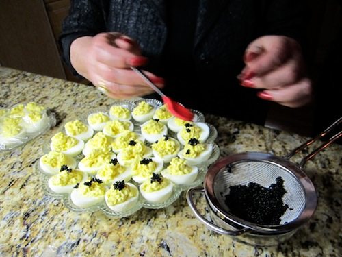 Dawn adds caviar to the deviled eggs.