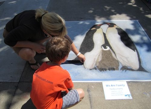 Ginney Gray Davis and her son, Gray Davis, work on a portrait of a penguin family. 