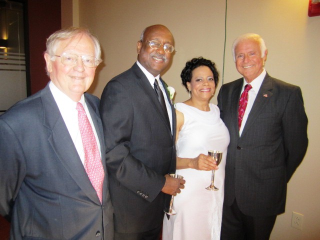 Three mayors pose with the bride.