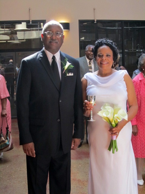 The bride and groom arrive at the reception.