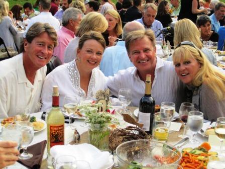 harrises-lands Stephen and April Harris, left, were the major sponsors once again this year of Symphony in the Park. Jupiter Entertainment was a sponsor, as well. Jupiter CEO Steve Land and his wife, Nancy, are at right.