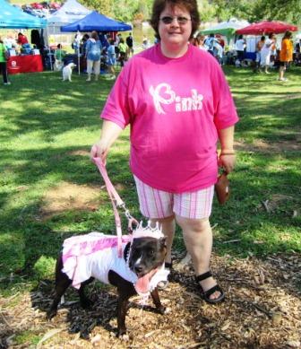 This dog is named Doodle. She is a pit bull who helps train foster puppies. She is with Ken Allyn.
