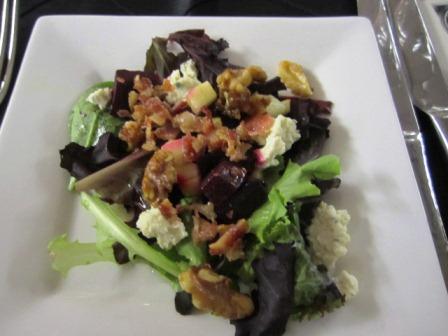 salad The salad featured mixed greens, roasted beets, caramelized walnuts and goat cheese. It was delicious paired with Kim Crawford Sauvignon Blanc.