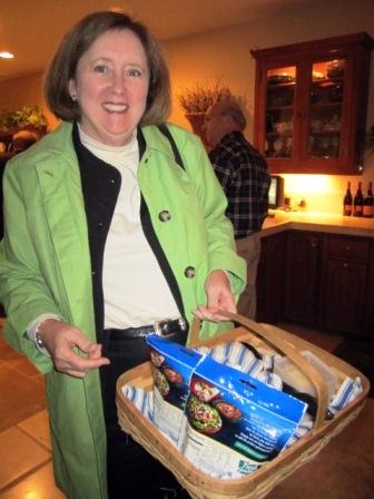 Class member Lynne Fain arrives with the components of a salad.