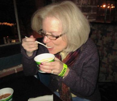 marie Marie Alcorn tastes one of the entries in the soup contest.