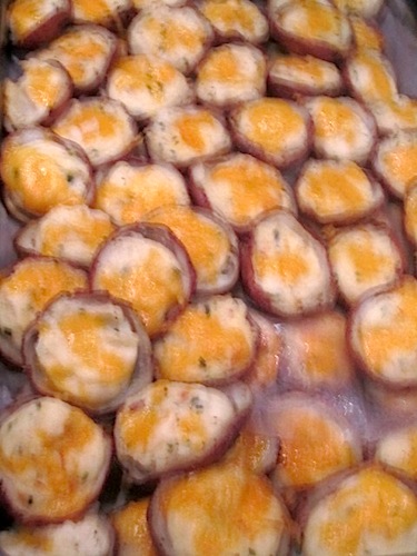 smoking-potatoes I know this photo looks blurry, but it's the smoke rising from these awesome twice-stuffed new potatoes. Rex Bradford Jones was the caterer. The "League Ladies" love him and it's easy to see why.