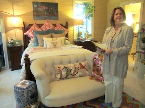 tricia Volunteer Tricia Kilgore of Koko Fit Club welcomed guests to another guest bedroom. This one was designed by Paige Stephens.