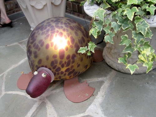 turtle This turtle is poised right beside the front door to greet visitors. Its shell lights up.