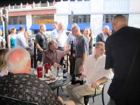 brewery-stop Once we got to Gay Street, we stopped to greet friends at the Downtown Grille and Brewery. Bill is talking to Scott Barker of the News Sentinel. Scott McNutt is to the right. And photographer Gary Heatherly has his back to the camera. Come on, guys, get a move on!