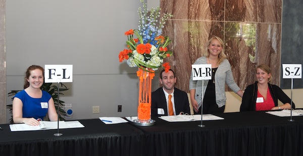 lauren-and-interns Staffing the check-in table were Moxley Carmichael account executive Lauren Christ, standing, and interns, from left, Julia Gardial, Andrew Tanker, and Katheen Carlson.