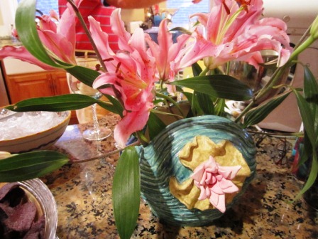 moniques-vase Bruce and Monique's son, John, made this stunning vase when he was in high school. These lilies are just perfect in it!