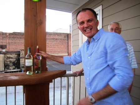 tim-gets-wine We finally make it to the roof and Tim grabs the -- yay! -- pinot grigio! (Not a drop of chardonnay in sight!)