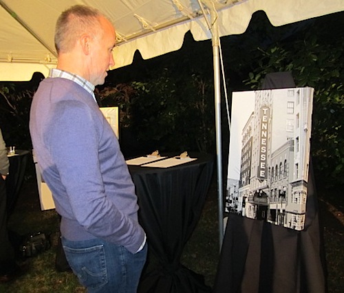eddie Host Eddie Mannis checks out a piece of art in the silent auction.