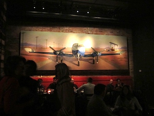 airplane-in-alleia-bar The bar is very dark and features this huge mural of an airplane.