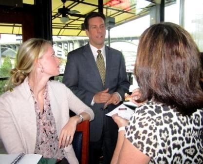 paul-susan-elaine Paul Hohe, general manager of Ruth's Chris, and Susan Martino of Second Harvest, chat with Elaine Streno, back to camera.