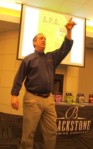teacher Blackstone co-founder Kent Taylor proposing a toast.