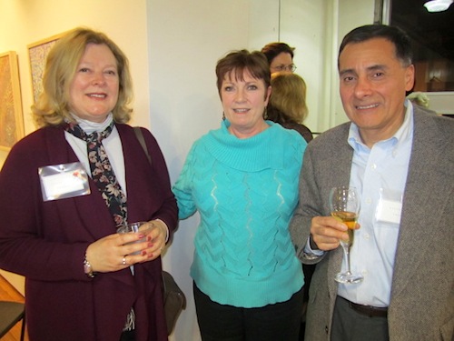 mingling Terri Karlsson, owner of The Tree and Vine, center, mingles with guests at the party.