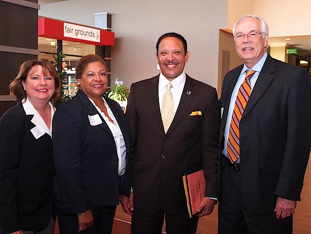 They both do the honors with Moxley Carmichael President Alan Carmichael, right, and me.