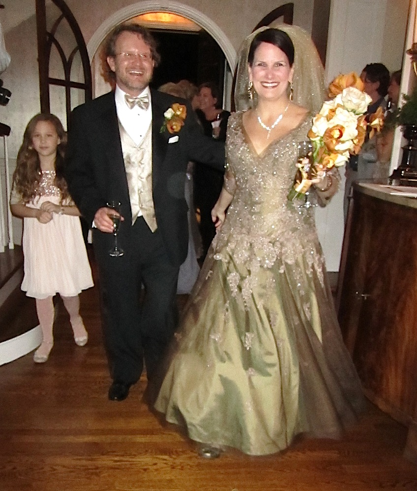 The already married Joey Creswell and Janet Testerman enter what we thought was their surprise engagement party. One of Joey's daughters, Georgie, is behind them.