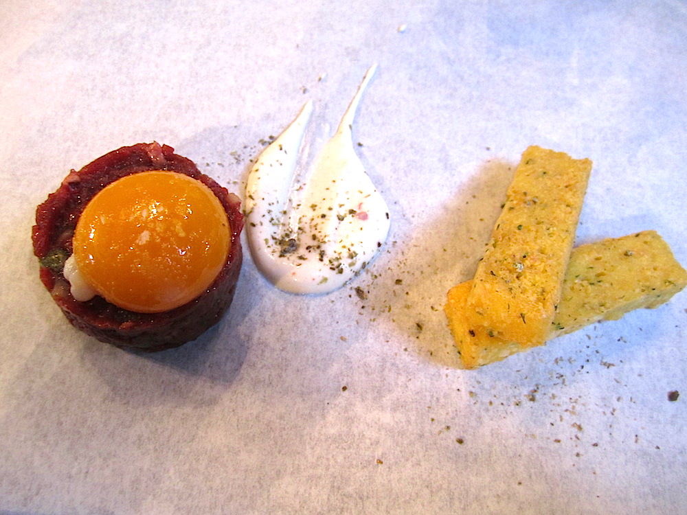 Beef heart tartare topped with a lightly poached egg yolk, chickpea fries, capers and an anchovy garlic aioli. Yes, I actually tasted it, with some guidance from Stanton on how to prepare it. (Mix the egg and aioli in with the beef.) It was OK. Alan ate all of his!