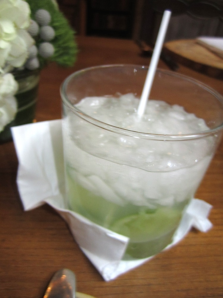 It was a spicy caipirinha, a variation of the official cocktail of Brazil. It contains cacacha, muddled lime and jalapeno, sugar and crushed ice. Delish.