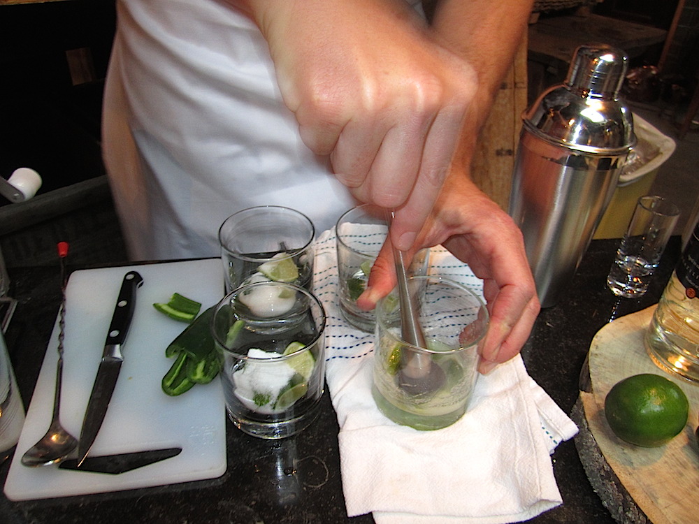 First things first: a signature cocktail. I was not allowed to show the face of the mixologist muddling our delicious welcoming drink.