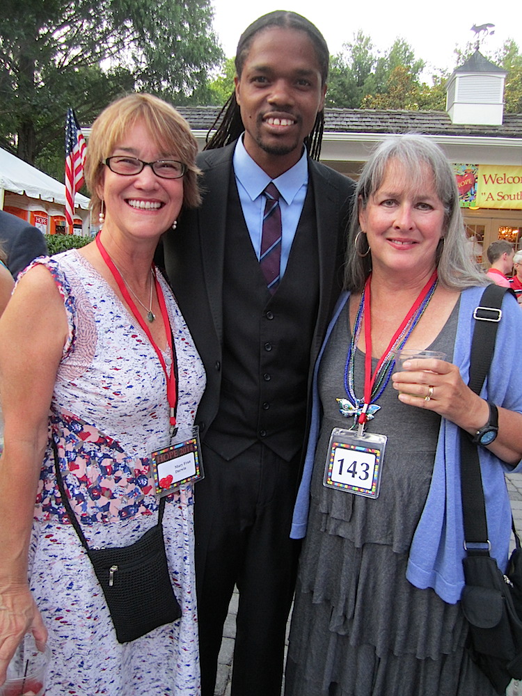 Mary Fran Darwin, left, and Jenny Hines with entertainer Landau Eugene Murphy, Jr., before he took the stage.