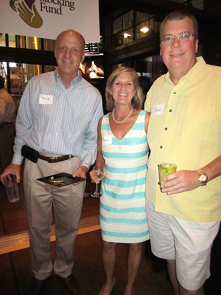 Publisher Patrick Birmingham, right, with Scripps executive Bruce Hartmann and his wife, Tami.