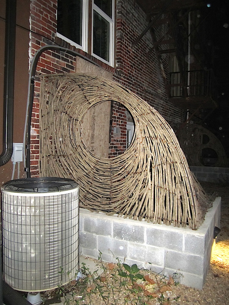 Interesting twig sculptures divided the back lots of some of the residences out there.