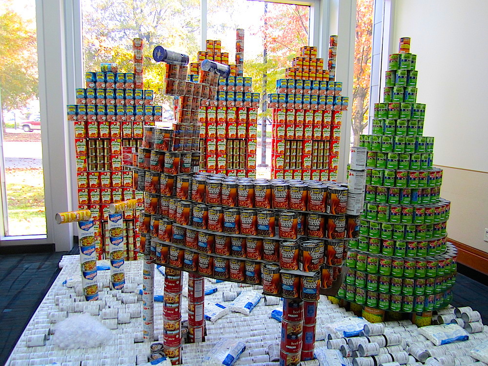 This is called "Grandma Got CANover by a Reindeer" and was created by Studio Four Design, CBI and Merit Construction. It's based on the country novelty song, "Grandma Got Run Over by a Reindeer."