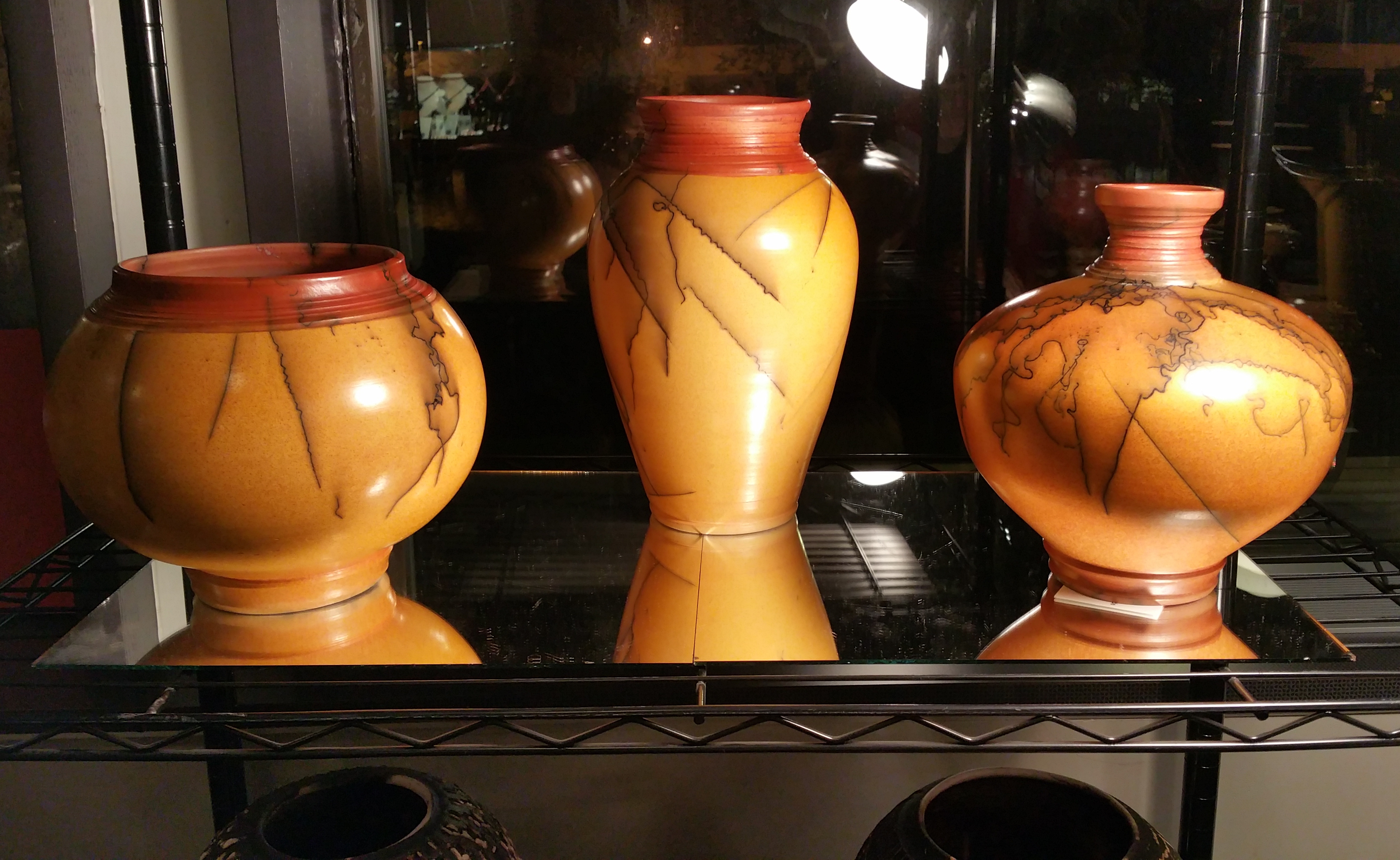 Here's a closer look of pieces made with a process called Horse Hair Raku.