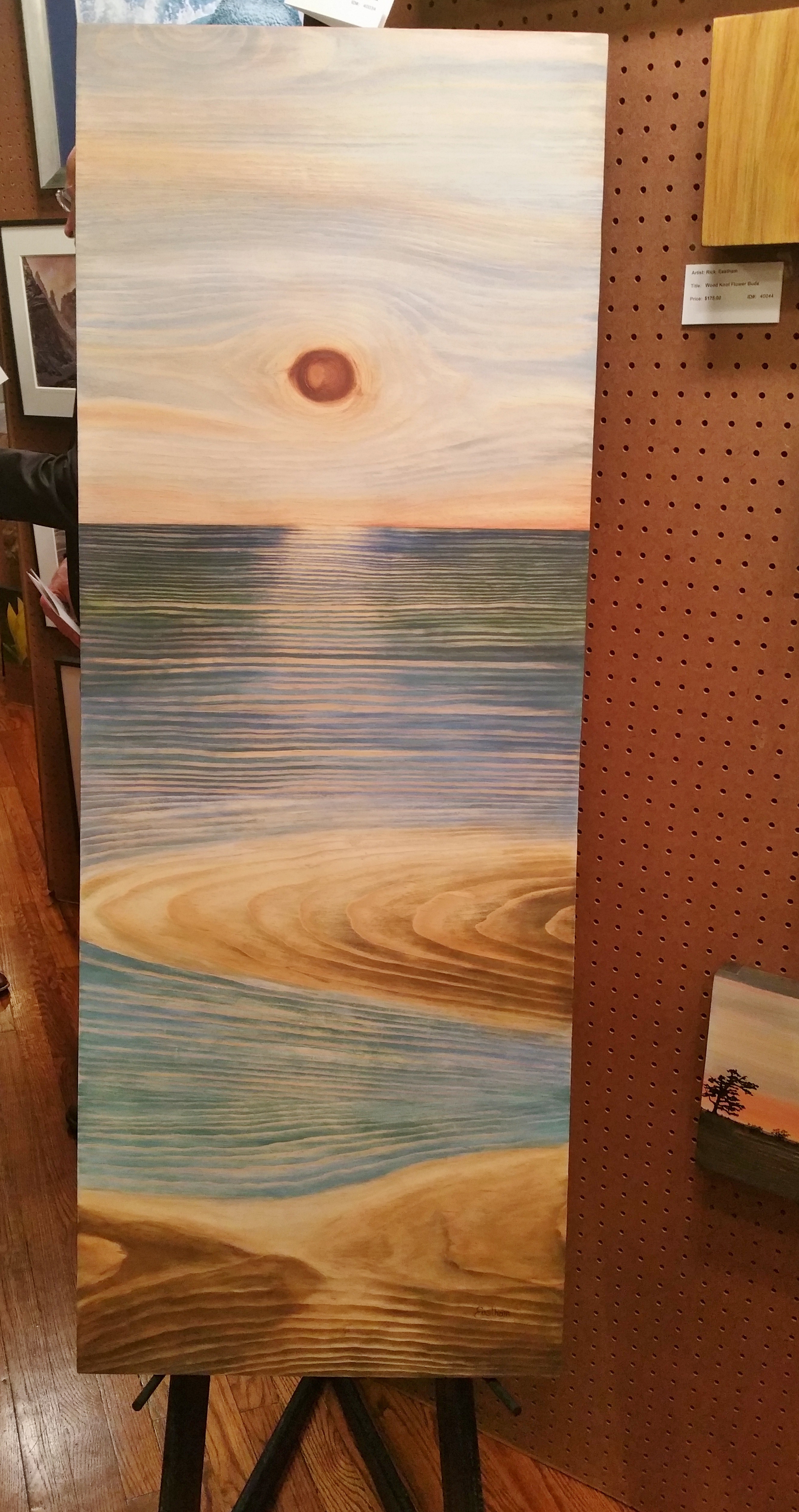 Artist Rick Eastham uses the natural grain of wood to create his pieces. The knots represent the sun.