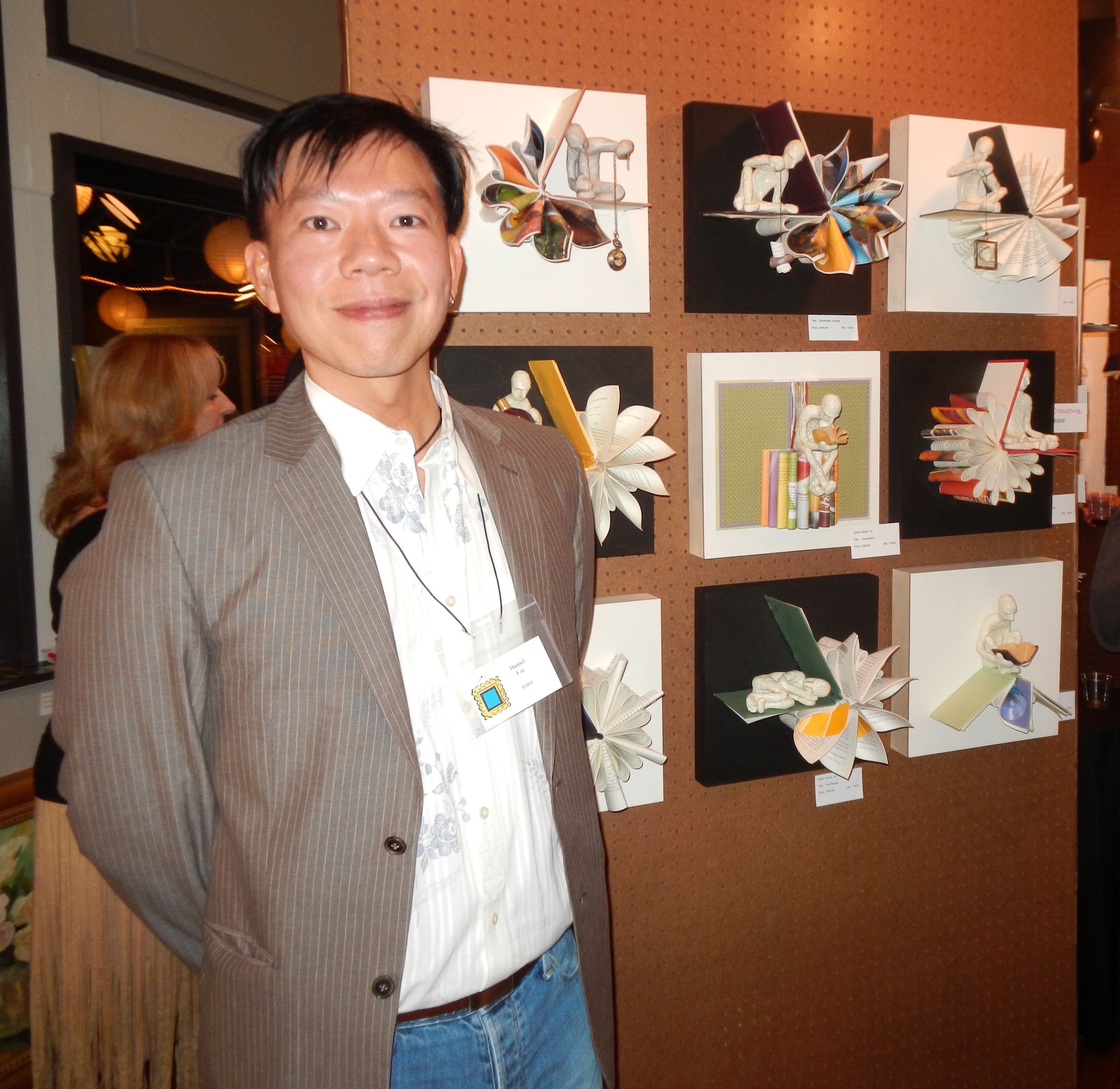 Artist Daniel Lai with his whimsical pieces.