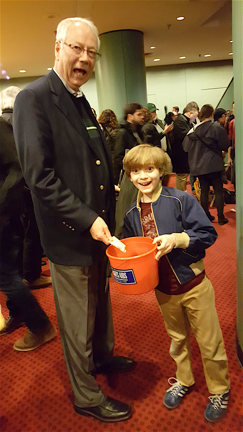Alan giving a "Broadway Cares" donation to actor Zell Steele Morrow who played the younger son in Fun Home.