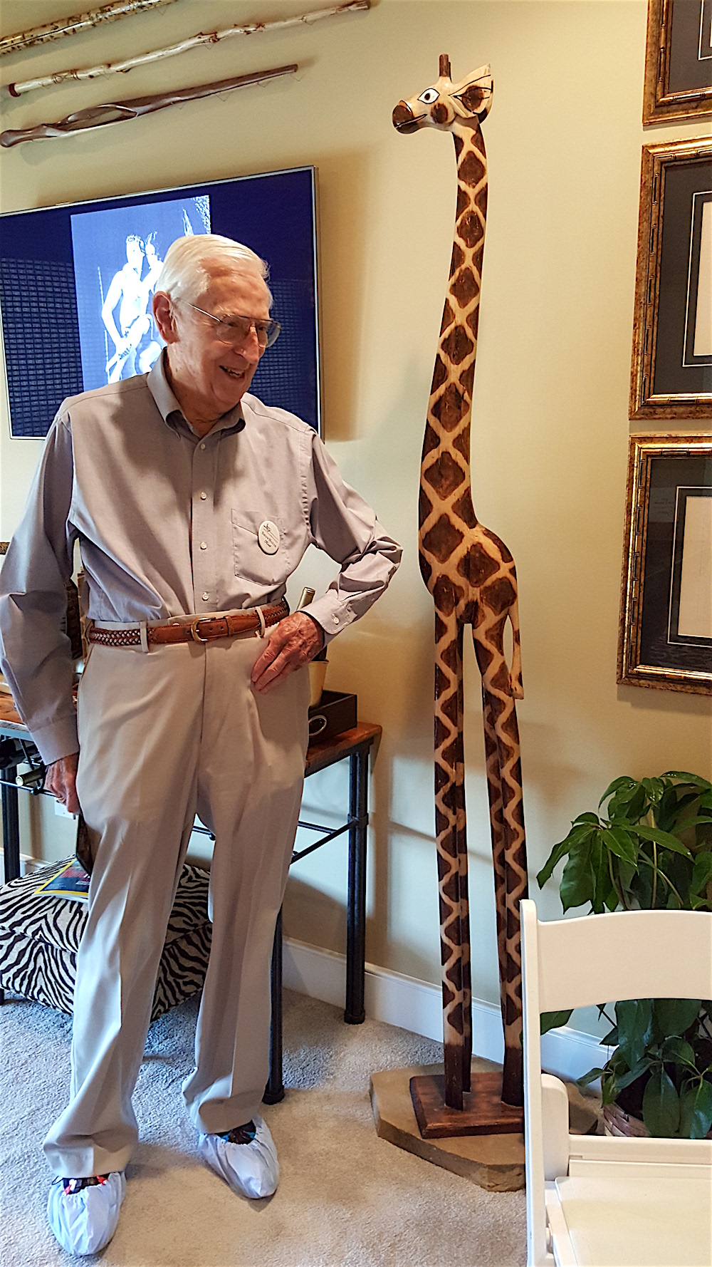 I prevailed upon host Jim Lyle to stand by this cute giraffe to demonstrate how tall it is!