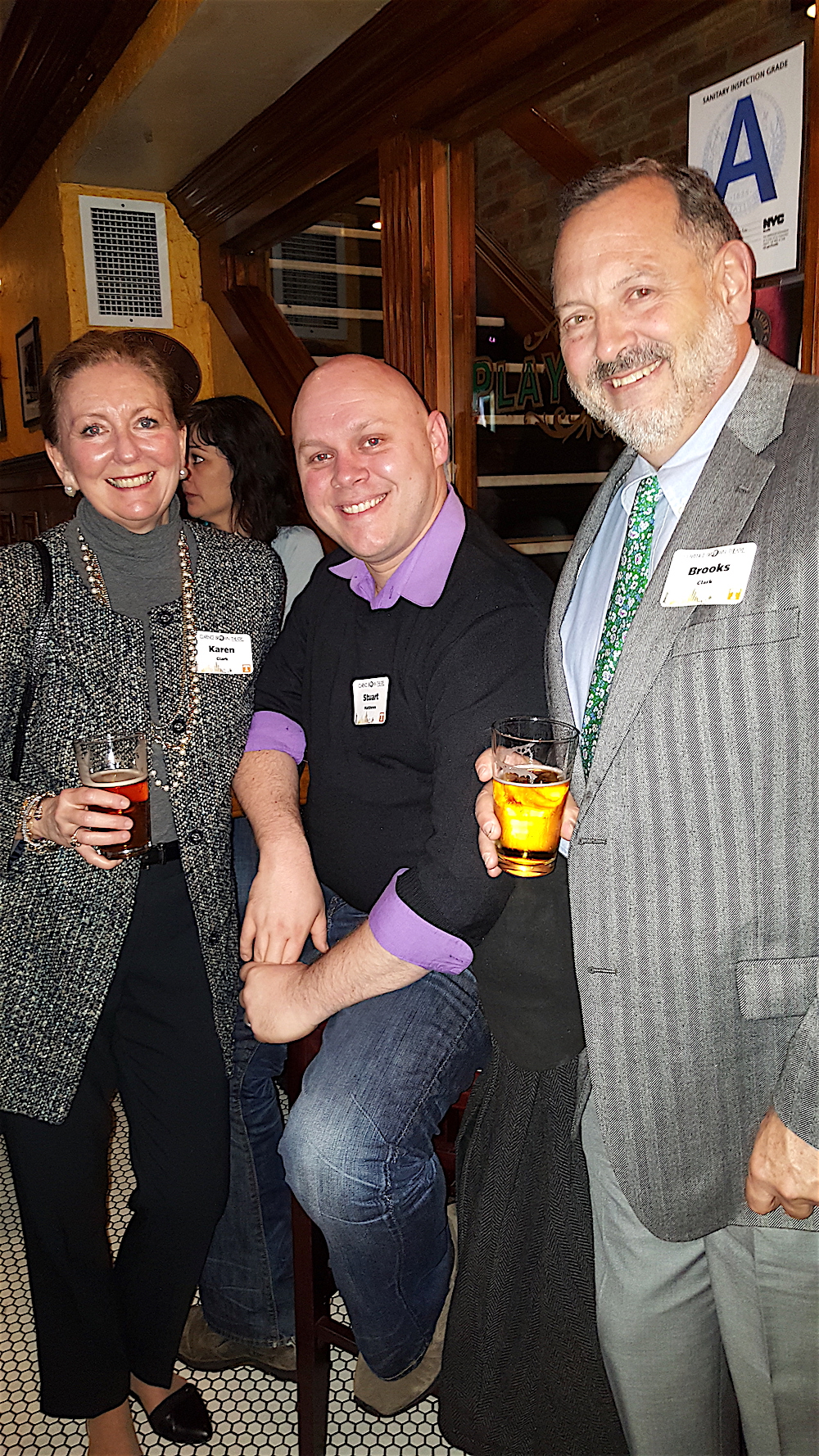 Karen and Brooks Clark with alum Stuart Matthews, center.