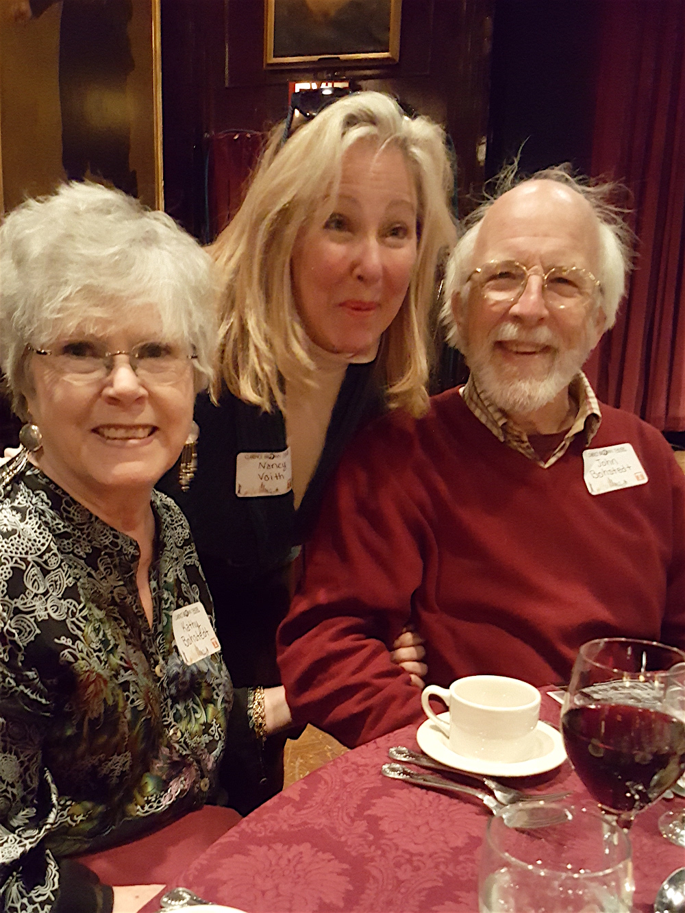 Nancy Voith, center, visiting with Kathy and John Bohstedt.