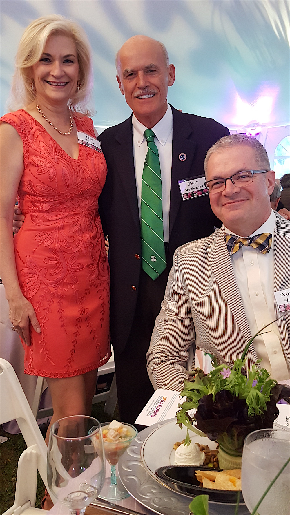 The evening's auctioneer, Bear Stephenson, center, with Lisa Stearns and Norman Hammitt.