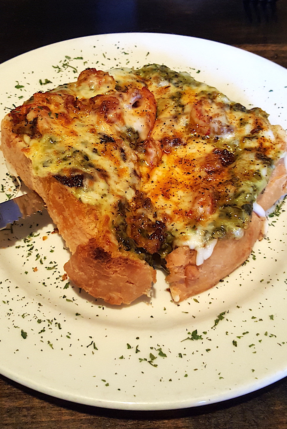 We split a crawfish tartine: wonderful homemade bread covered with sauteed crawfish, creamed spinach and cheese and broiled to tasty gooeyness.