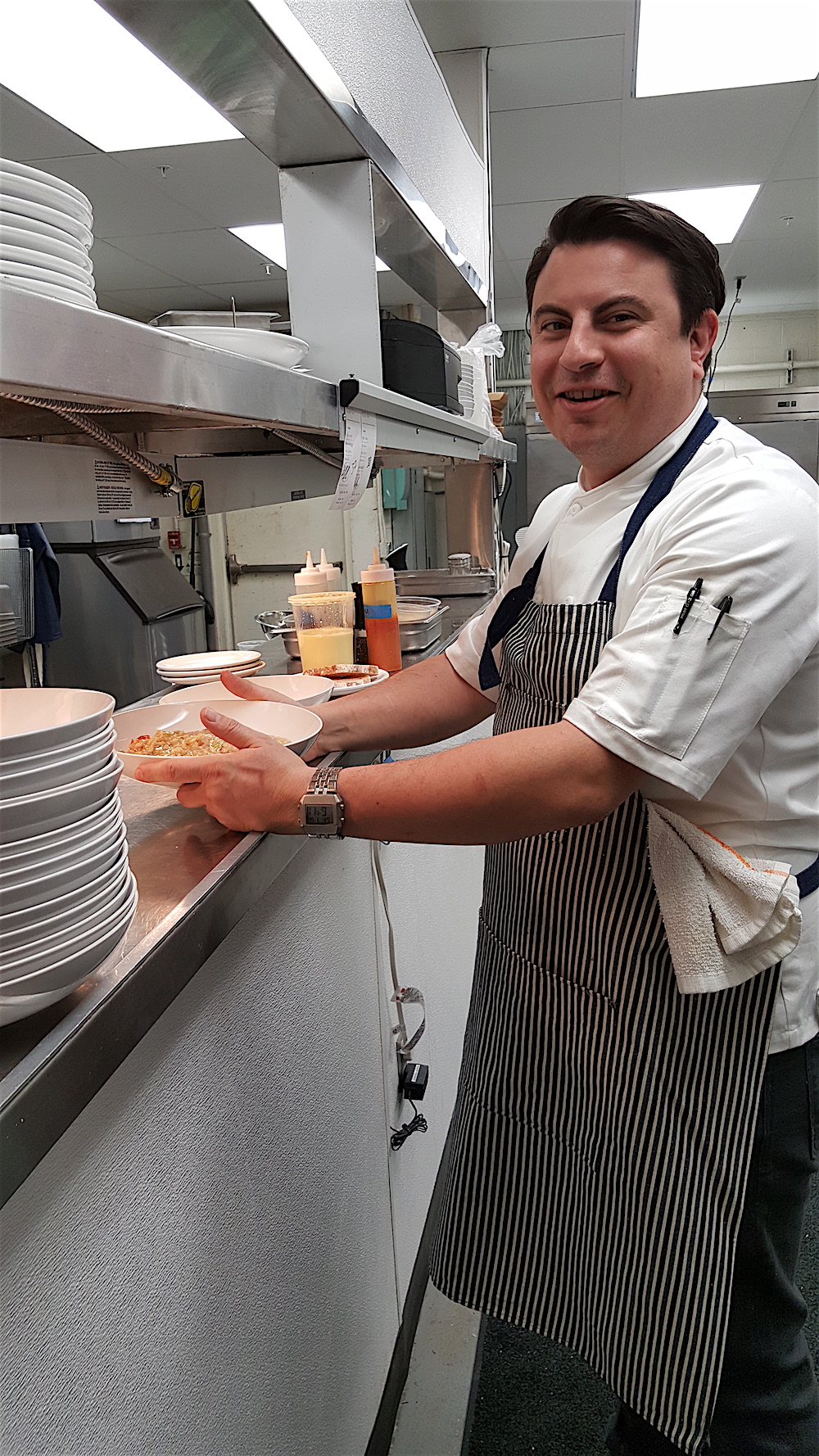 Chef owner Matt Gallaher works at his new restaurant, Emilia, this past Saturday night.
