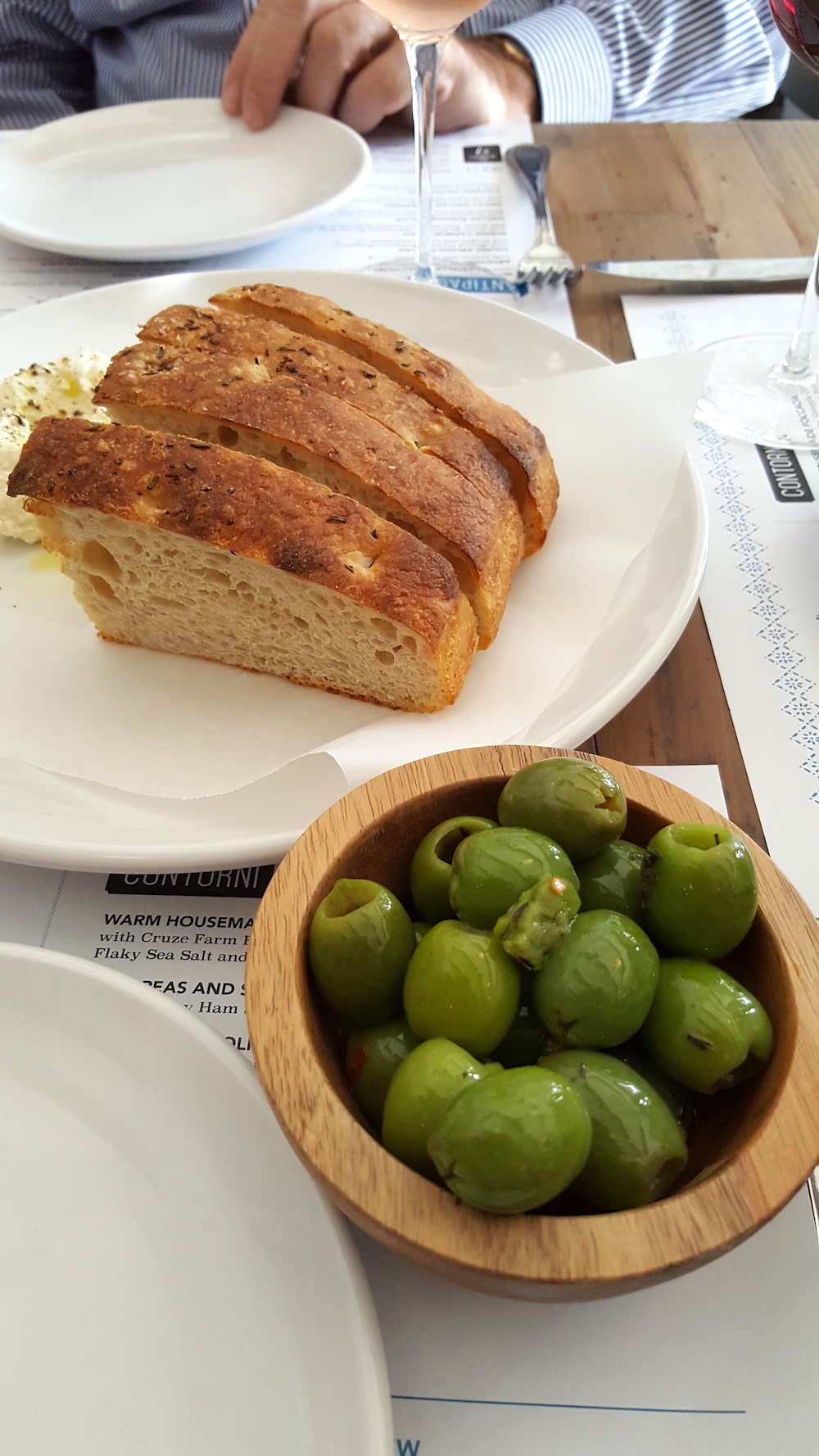 Warm housemade foccacia and warm Castelvetrano olives started our meal.