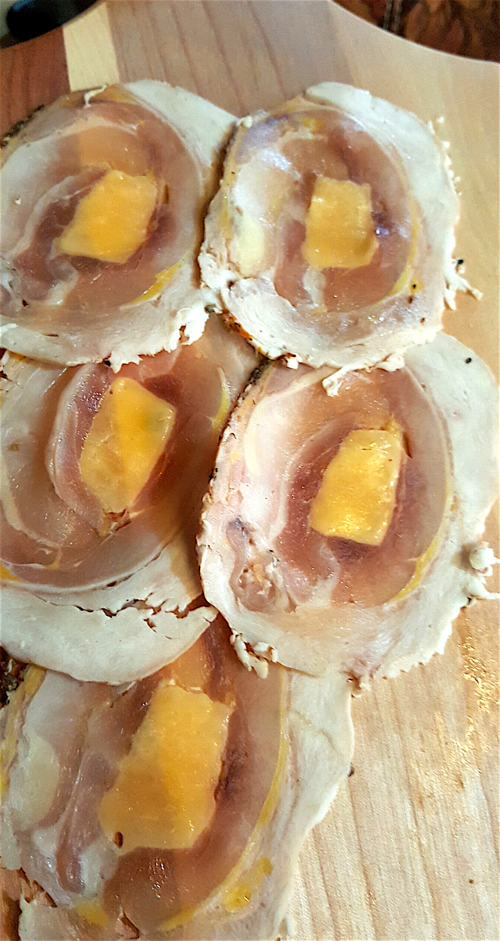 These are fire-roasted pheasant, chukar and quail roulades with cheddar and sorghum.