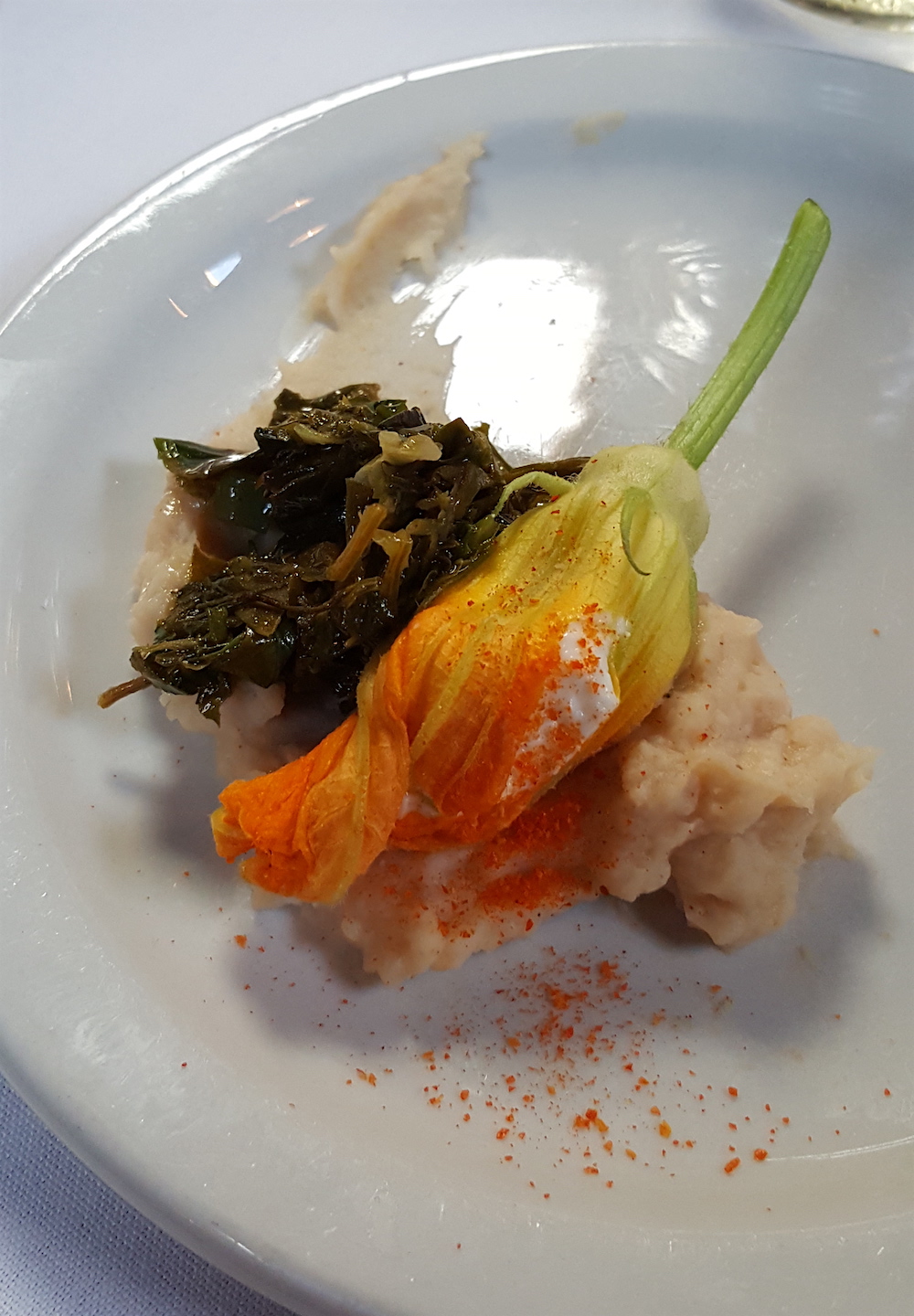 This course called "Squash" was a corn quesadilla (made into a cornmeal mush) topped with a goat cheese stuffed squash flower and some greens called lambs quarter. You see those little specks of orange on the plate? They were hot as heck (which I loved).